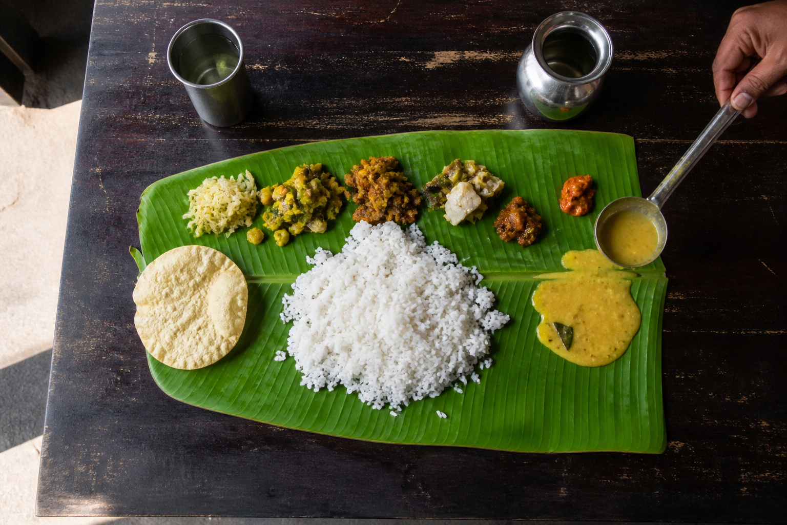 Rice and the vegetable sides come with unlimited refills. When you finish, fold the leaf towards you: folding it away is the signal that you did not enjoy the meal.