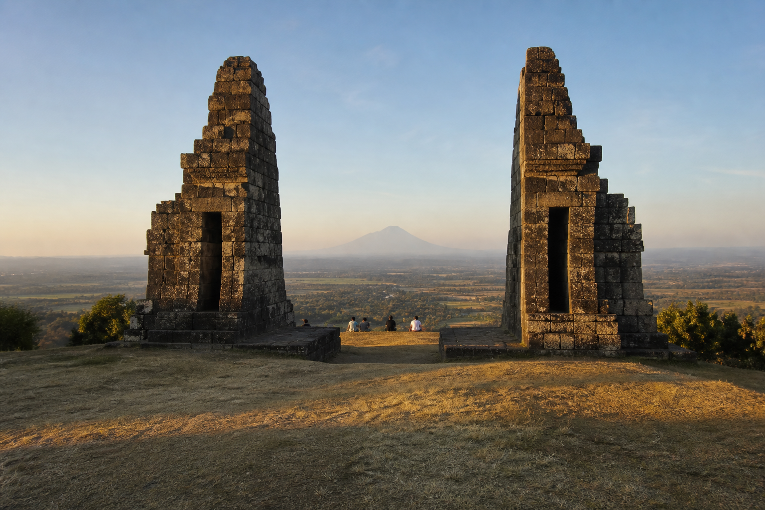 Ratu Boko at four in the afternoon. Arrive by then: the gates face west and the light goes quickly once it drops behind the plain.